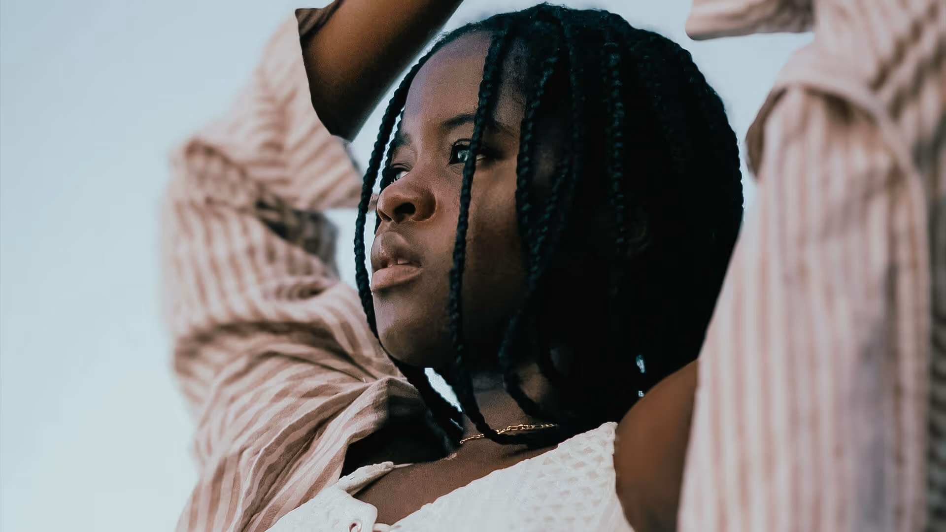 Photo of a dark skinned girl posing looking eary